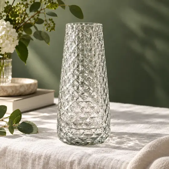 Clear diamond-pattern glass vase · Glass reflections