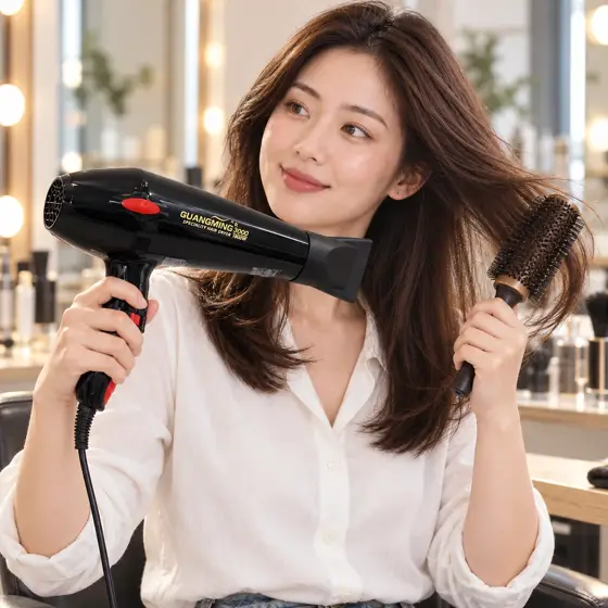 Black and red Guangming 3000 hairdryer · Salon styling scene