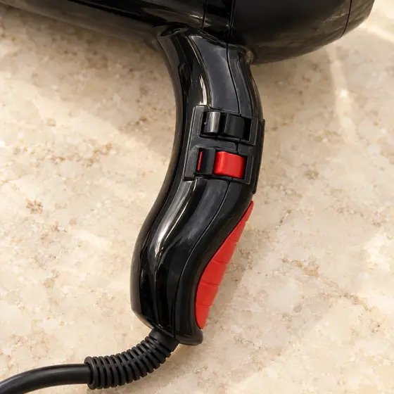 Black and red Guangming 3000 hairdryer · Switch and housing detail