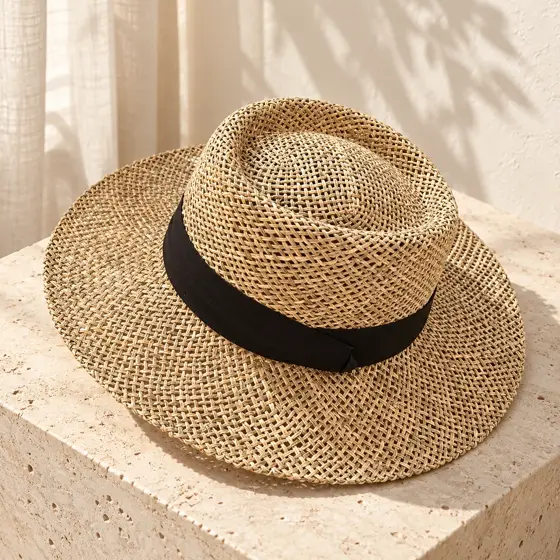 Open-weave straw hat · Product still life